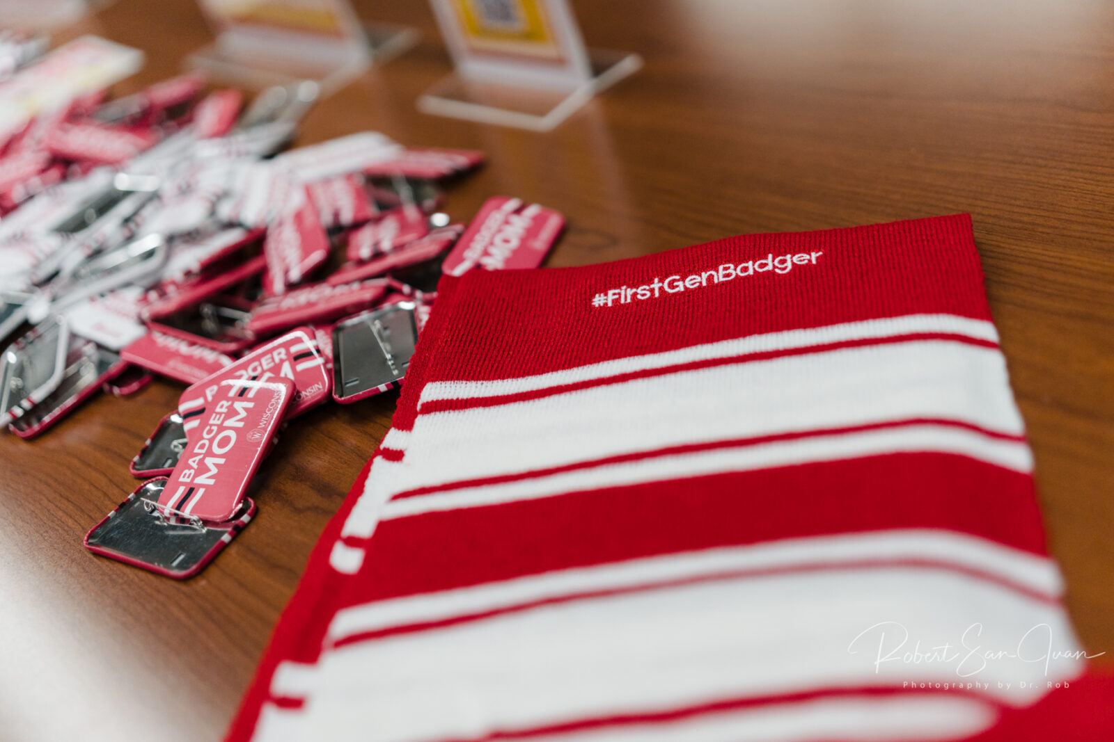 Image of a scarf that says #FirstGenBadger with some stickers